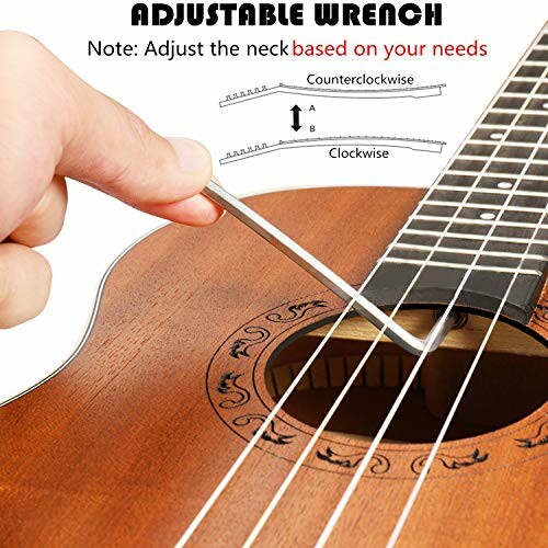 Hand using wrench to adjust guitar neck tension.